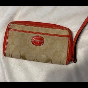Authentic designer wristlet wallet. Coral & tan.